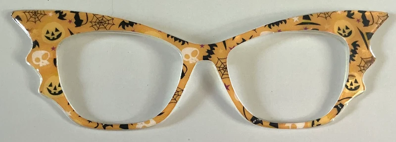 Wanda Topper; yellow skulls and bats with wings