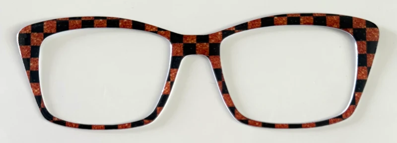 Kirby Topper; hybrid; orange glitter print and black checkered