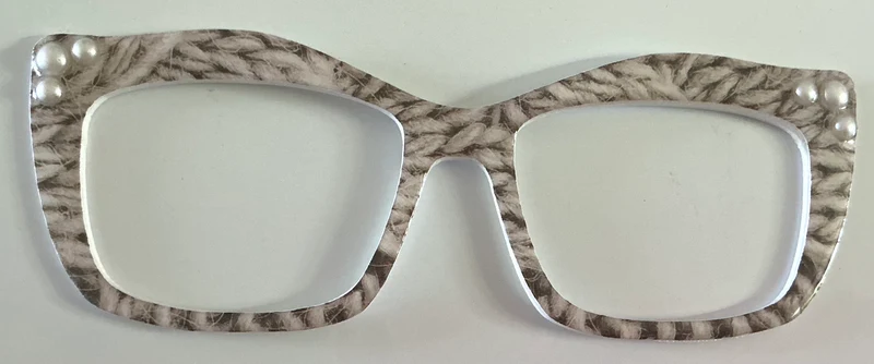 Kirby Topper; Creator; gray and white design with pearls in corners