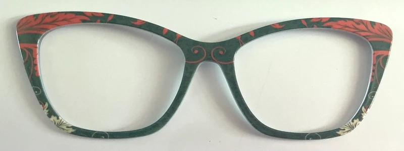 Wanda Topper; coral ornate leaves on green