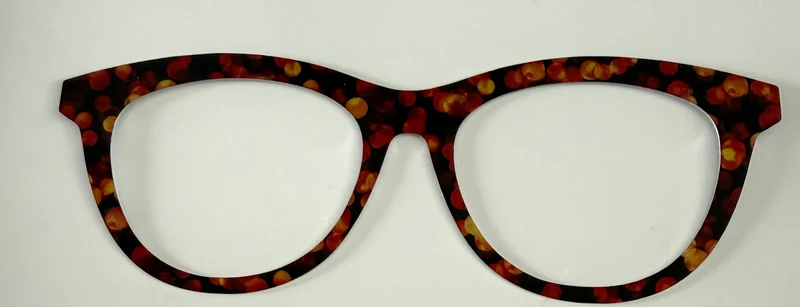 Brook Topper; metal; burgundy and gold circles on black